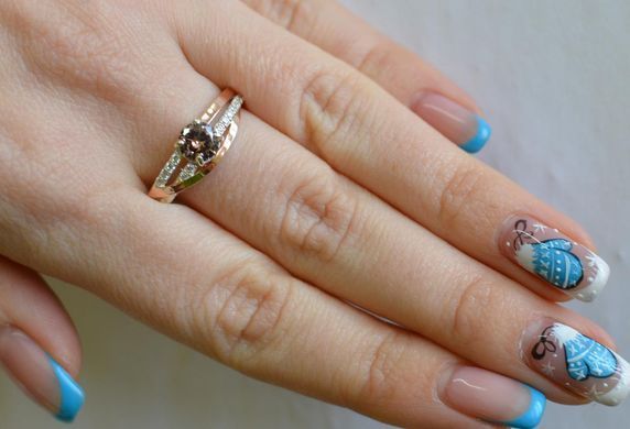 Серебряное кольцо с золотыми вставками 108к 15