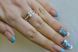 Серебряное кольцо с золотыми вставками 108к 15