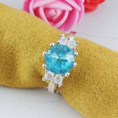 Серебряное кольцо с золотыми вставками размер 17 545/г к голубой