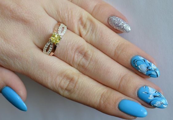 Серебряное кольцо с золотыми вставками 136к 15