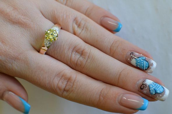 Серебряное кольцо с золотыми вставками 124к 15
